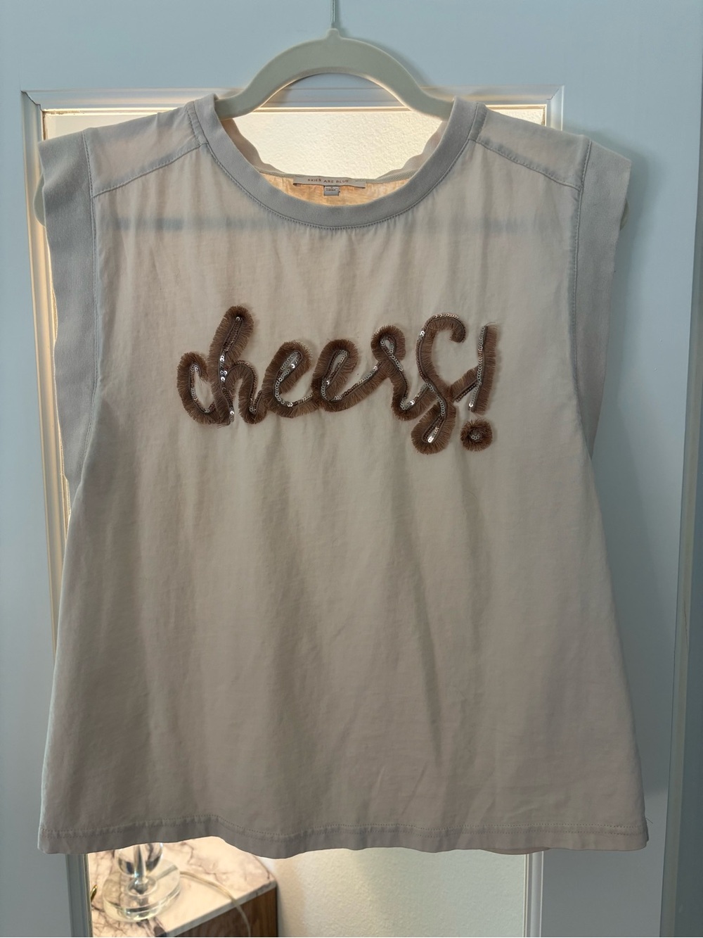 Skies Are Blue Cream Tank Top with Brown 'cheers!' Embroidery